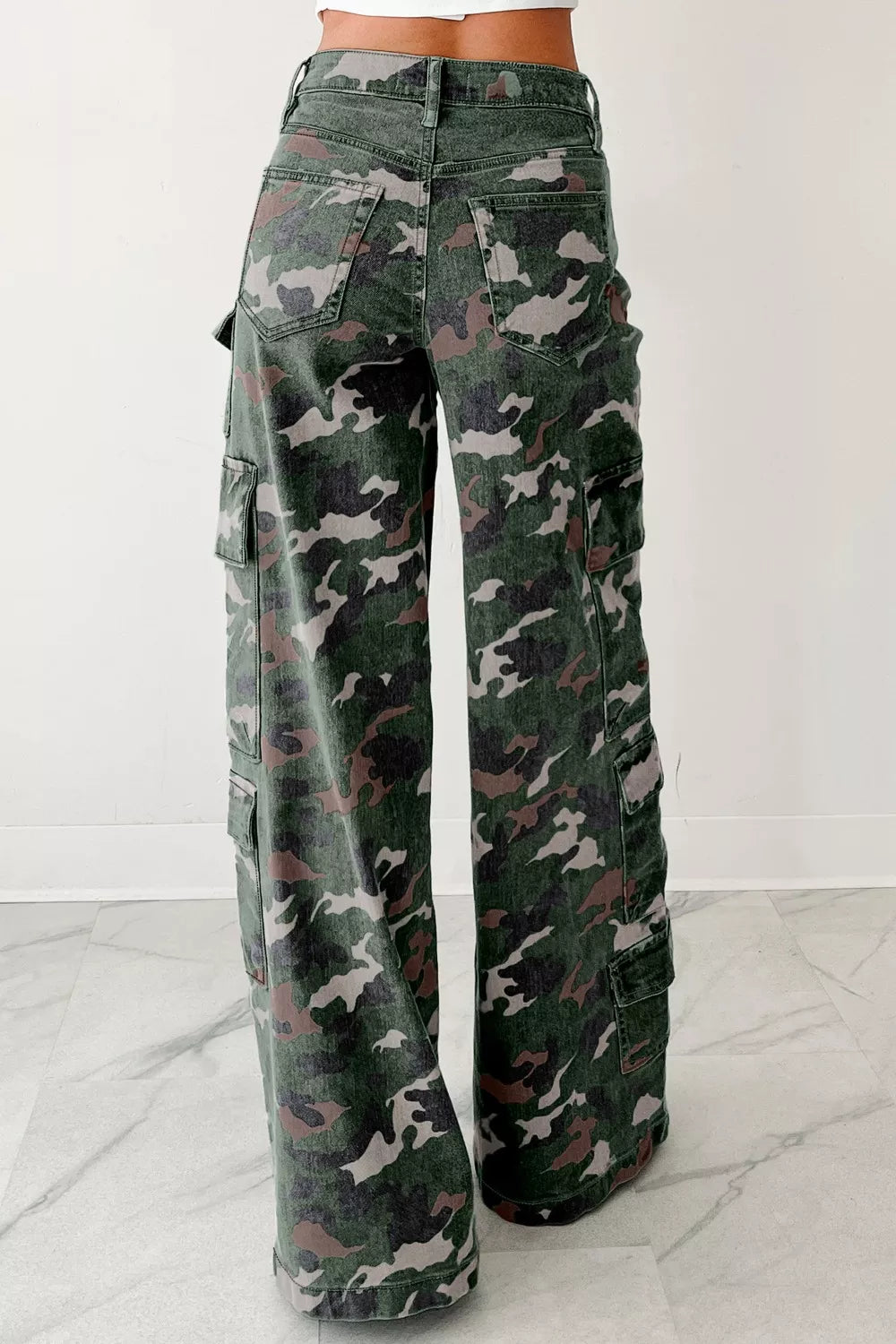 Camouflage cargo pants on a white background