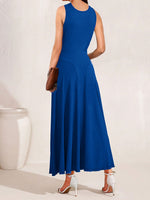 Woman wearing a blue dress against a white background