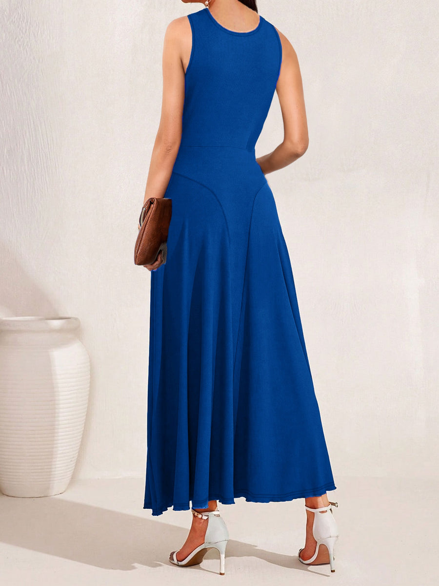 Woman wearing a blue dress against a white background