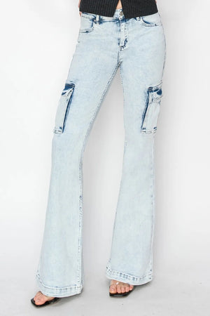 Light blue flared jeans on a plain background