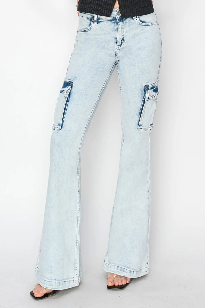 Light blue flared jeans on a plain background