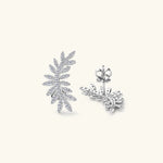 Silver leaf-shaped earrings on a white background