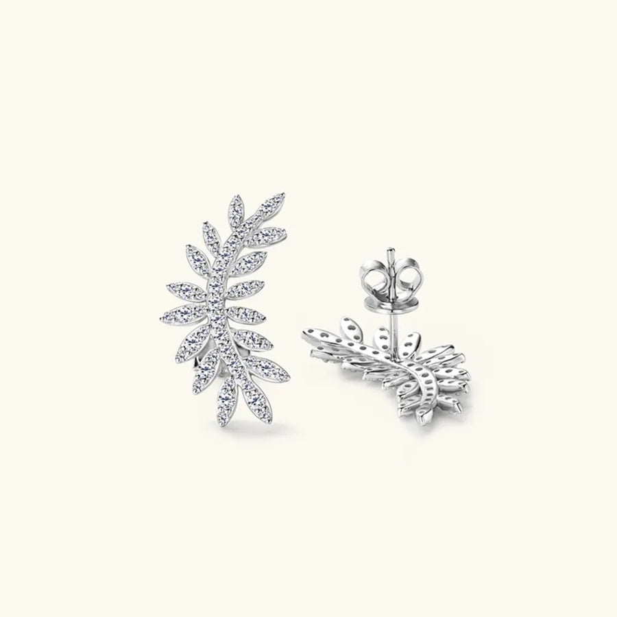 Silver leaf-shaped earrings on a white background