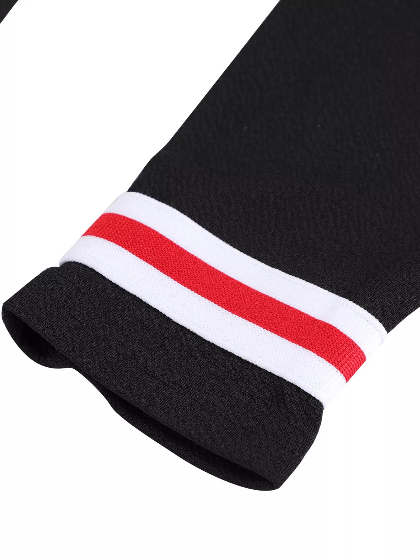 Black sock with a red and white striped band on a white background