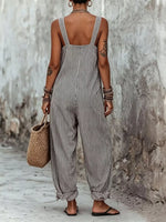 woman showing the back of Full Size Striped Square Neck Wide Leg Jumpsuit Plus Size