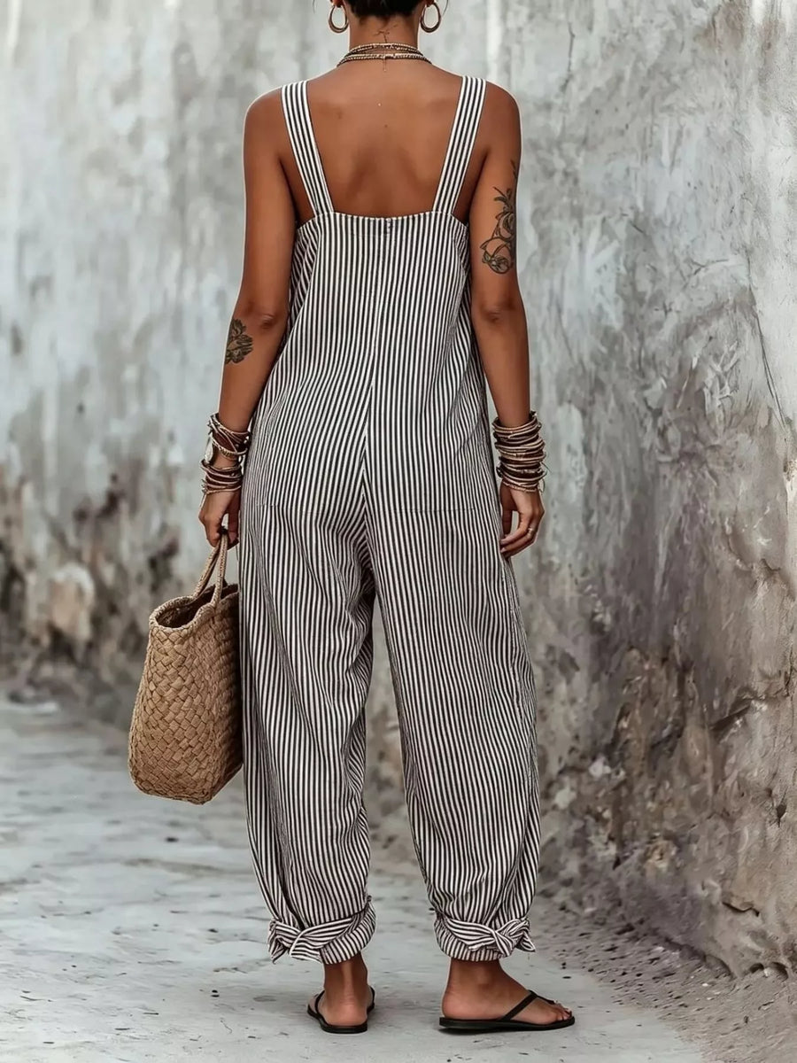 woman showing the back of Full Size Striped Square Neck Wide Leg Jumpsuit Plus Size