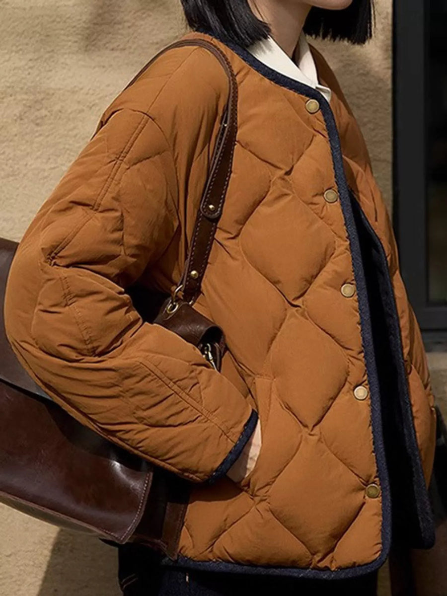 View of a lady wearing a brown Diamond-Quilted Lightweight Cropped Reversible Down Jacket
