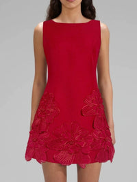 Red dress with floral details on a gray background