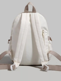 White backpack with beige straps on a light gray background