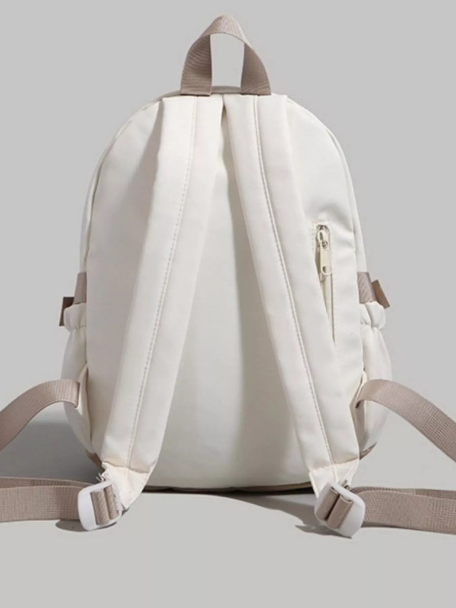 White backpack with beige straps on a light gray background