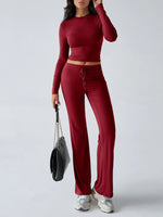 Person wearing a red outfit with a gray handbag on a white background