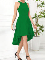 Green dress worn by a person with a white background and plant