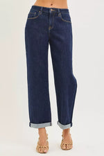 Blue jeans worn by a person on a white background