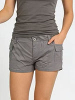 Person wearing gray tank top and shorts on a plain background
