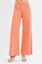 Coral wide-leg pants on a white background