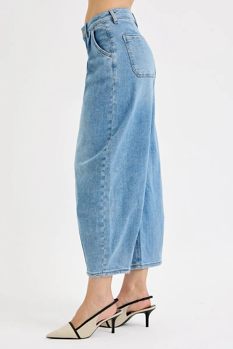 Light blue denim culottes worn by a person on a white background