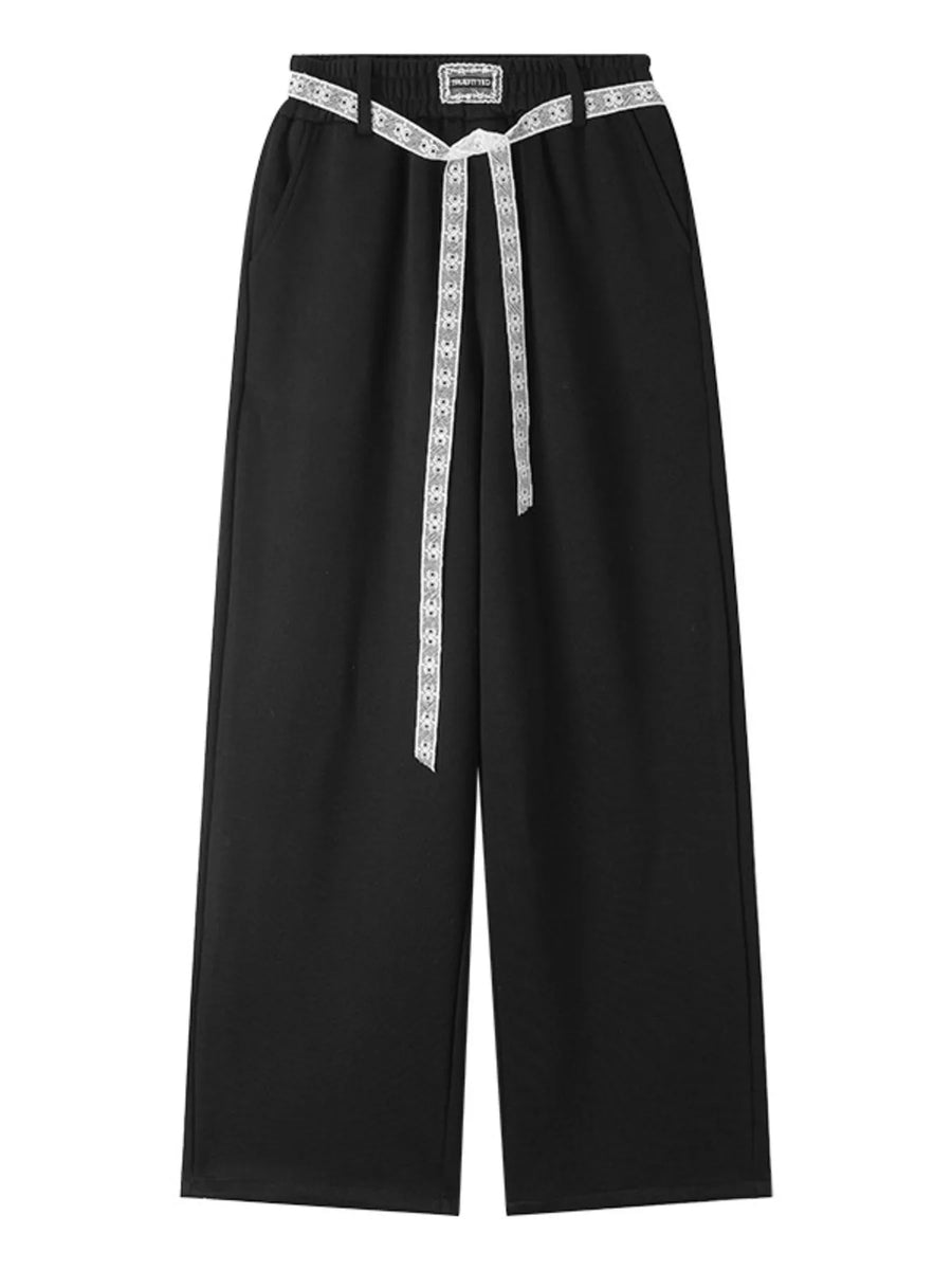 Black pants with a white belt on a white background