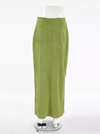 Green skirt on a mannequin against a white background