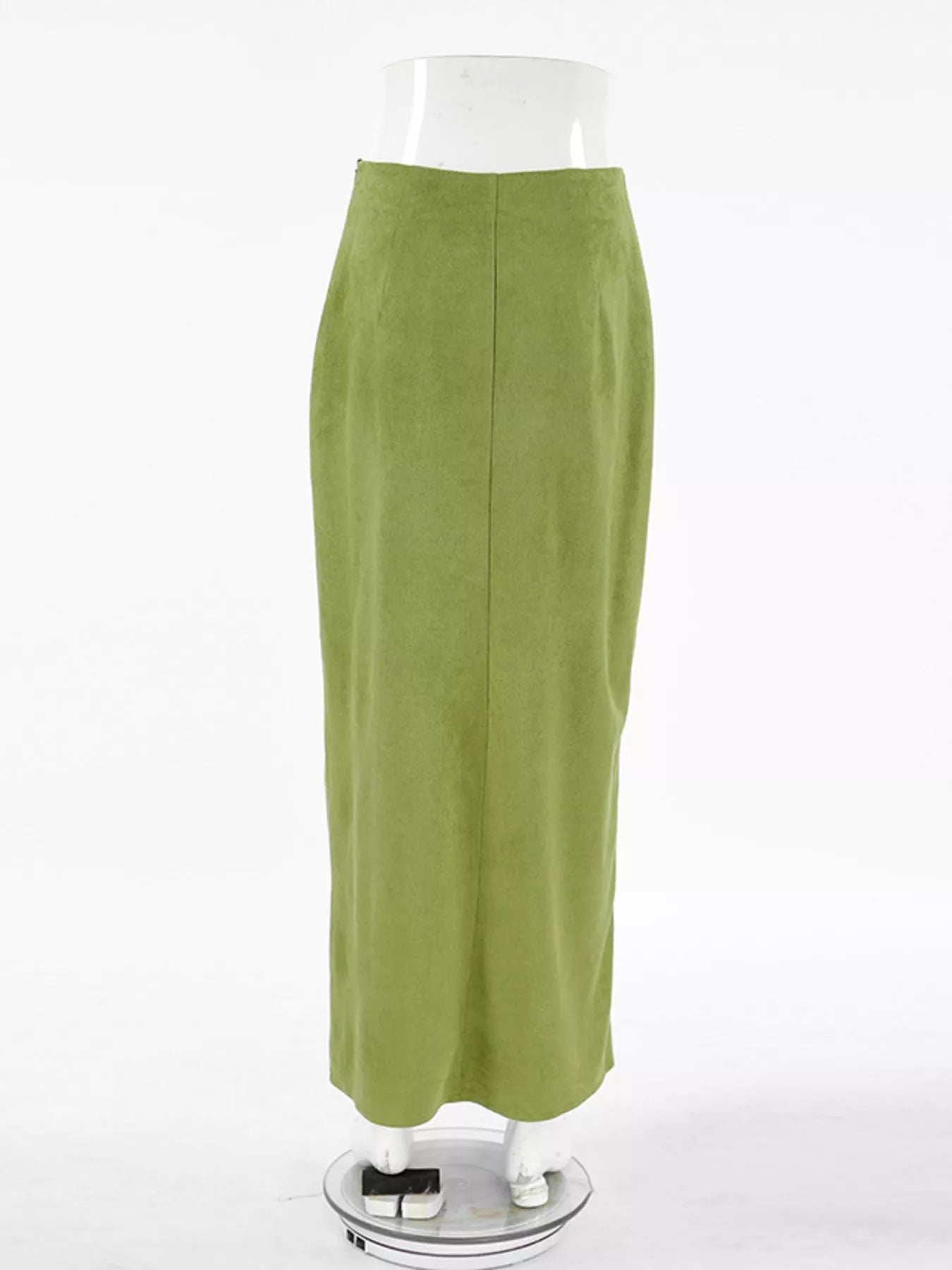 Green skirt on a mannequin against a white background