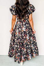 Woman wearing a floral dress with a plain background