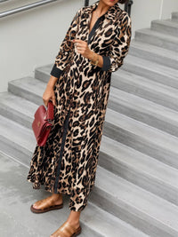 Person wearing a leopard print dress on a staircase