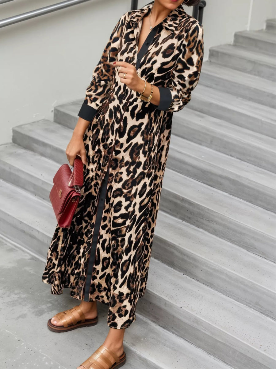 Person wearing a leopard print dress on a staircase