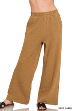 Brown wide-leg pants on a white background