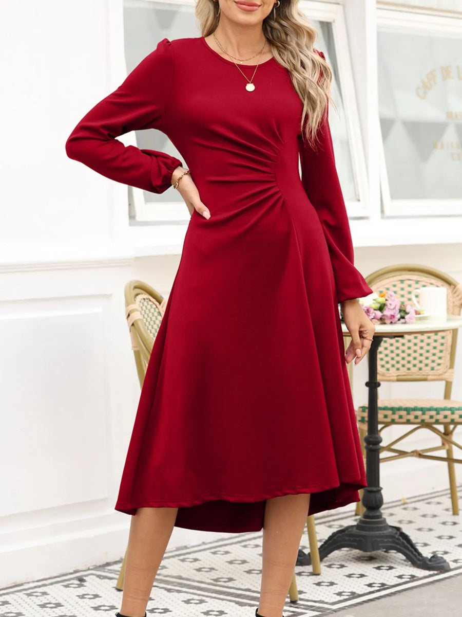 Woman wearing a red dress in an indoor setting