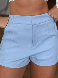 Light blue shorts worn by a person with a neutral background