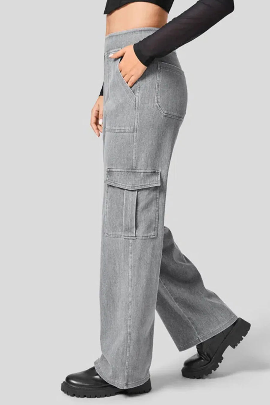 Person wearing gray cargo pants on a light gray background