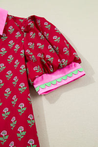 Red garment with floral pattern on a beige background