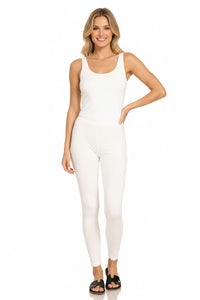 Woman wearing a white sleeveless jumpsuit on a white background