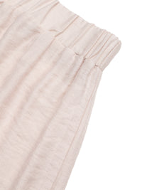 Close-up of light pink textured fabric on a white background
