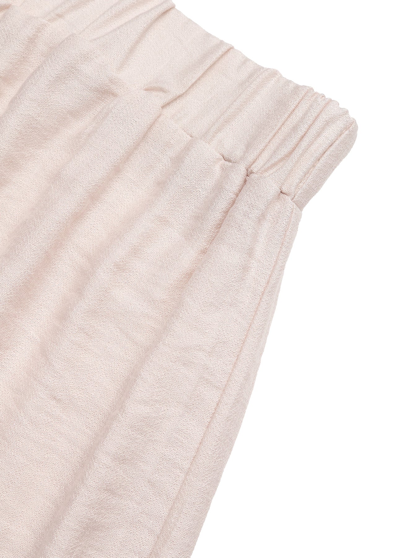 Close-up of light pink textured fabric on a white background