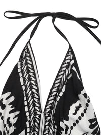 Black and white patterned top with halter neck design on a white background
