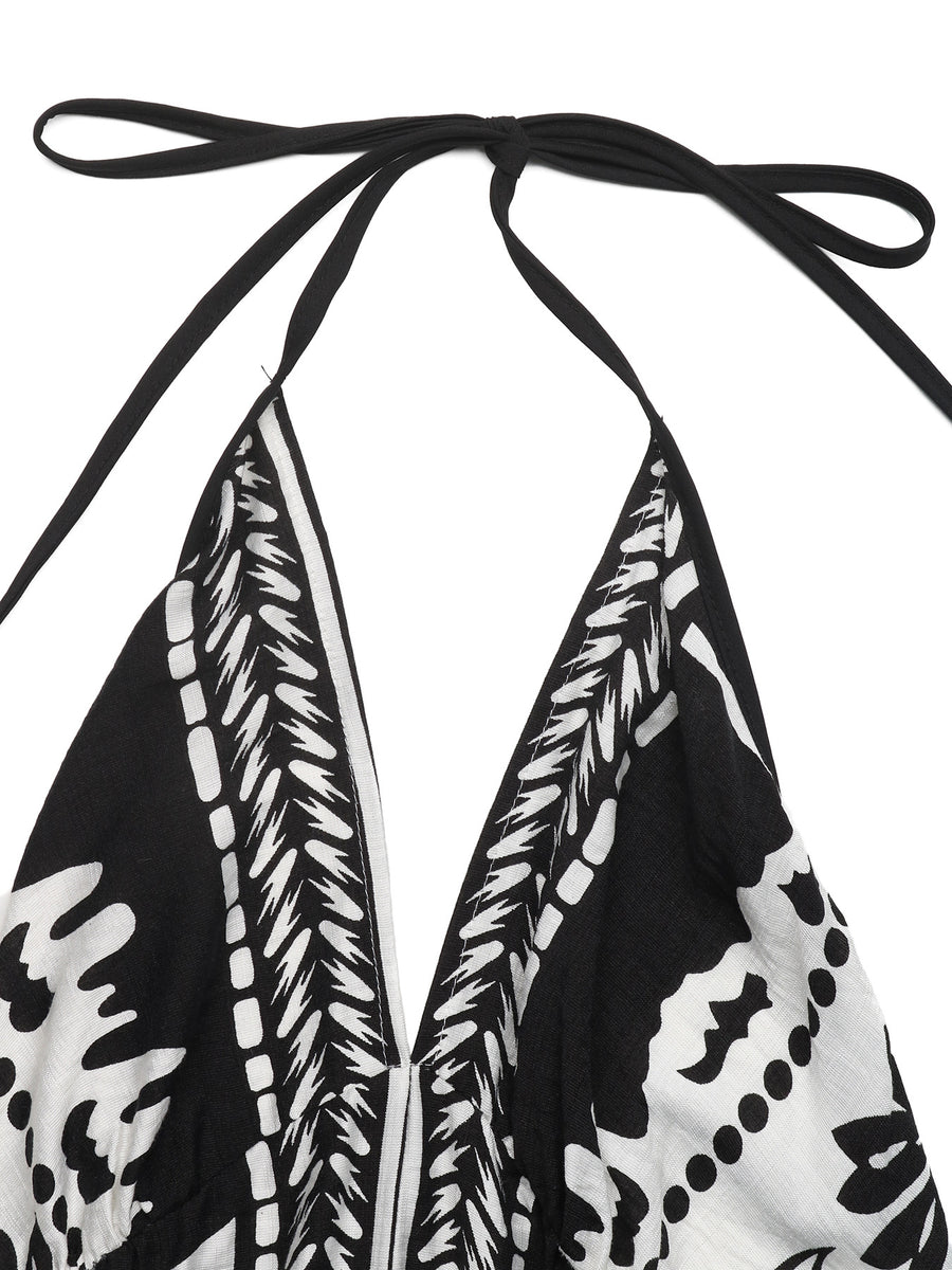 Black and white patterned top with halter neck design on a white background