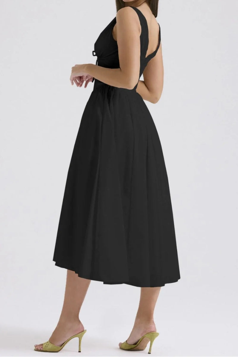 Black dress worn by a person on a white background