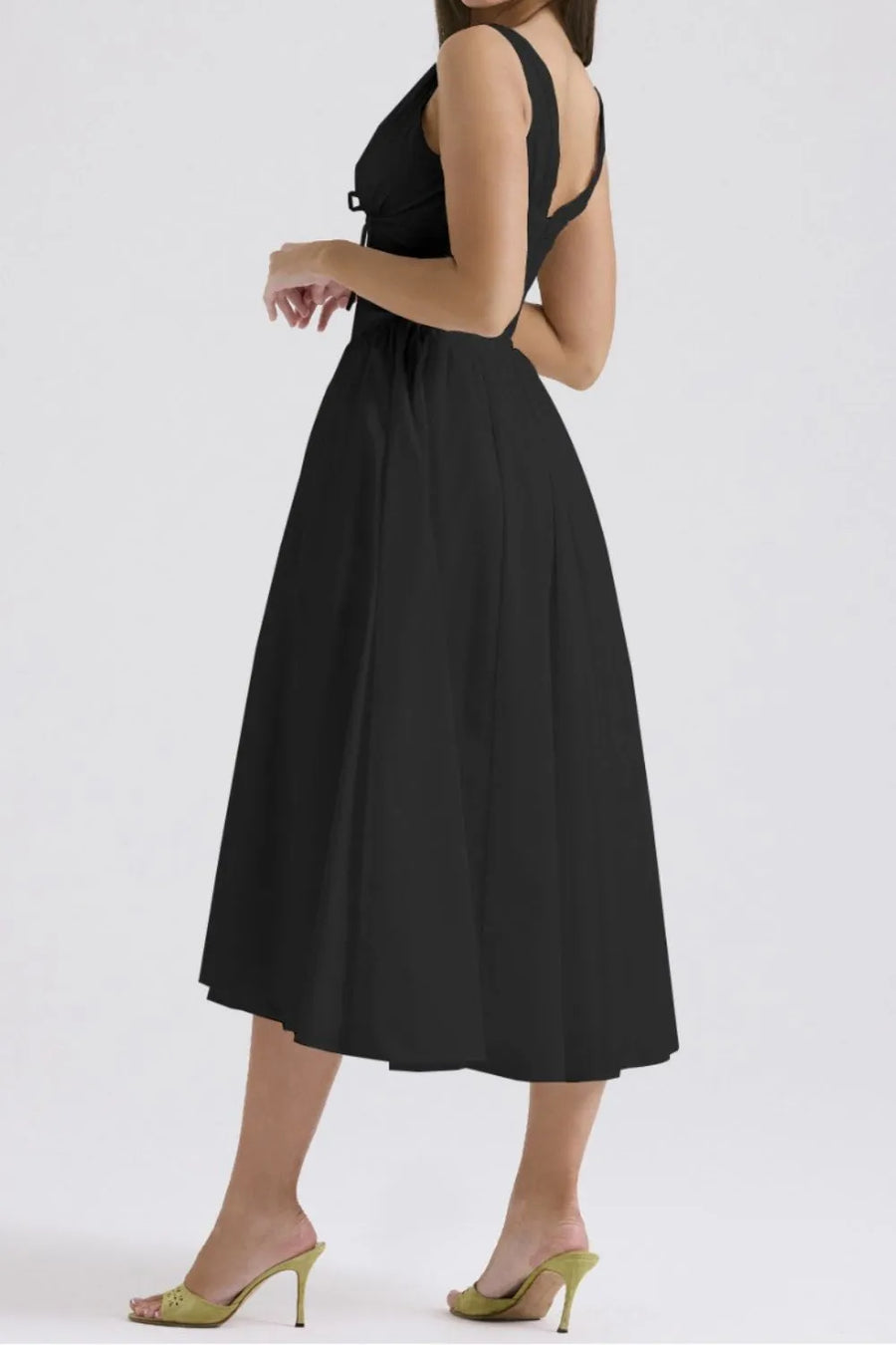 Black dress worn by a person on a white background