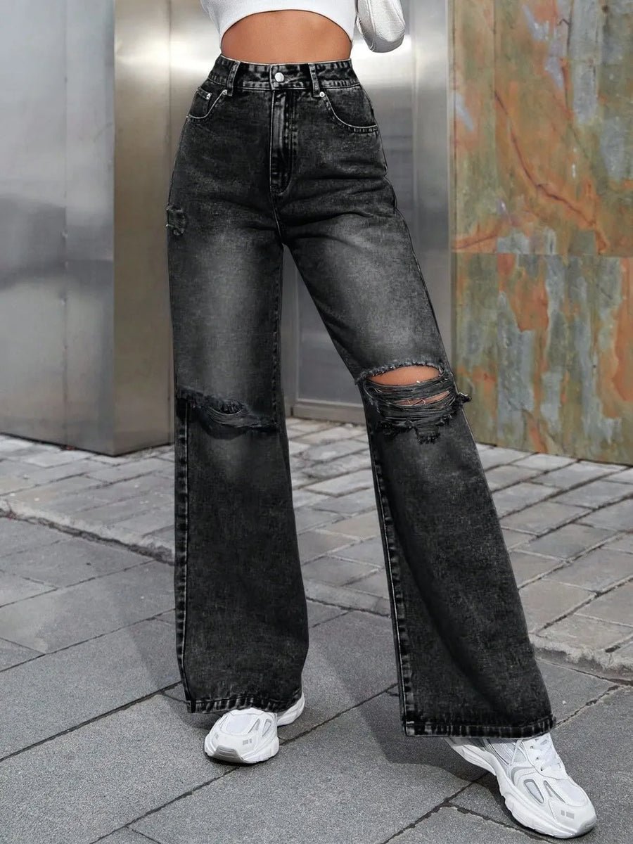 Black wide leg jeans with distress holes at the knees