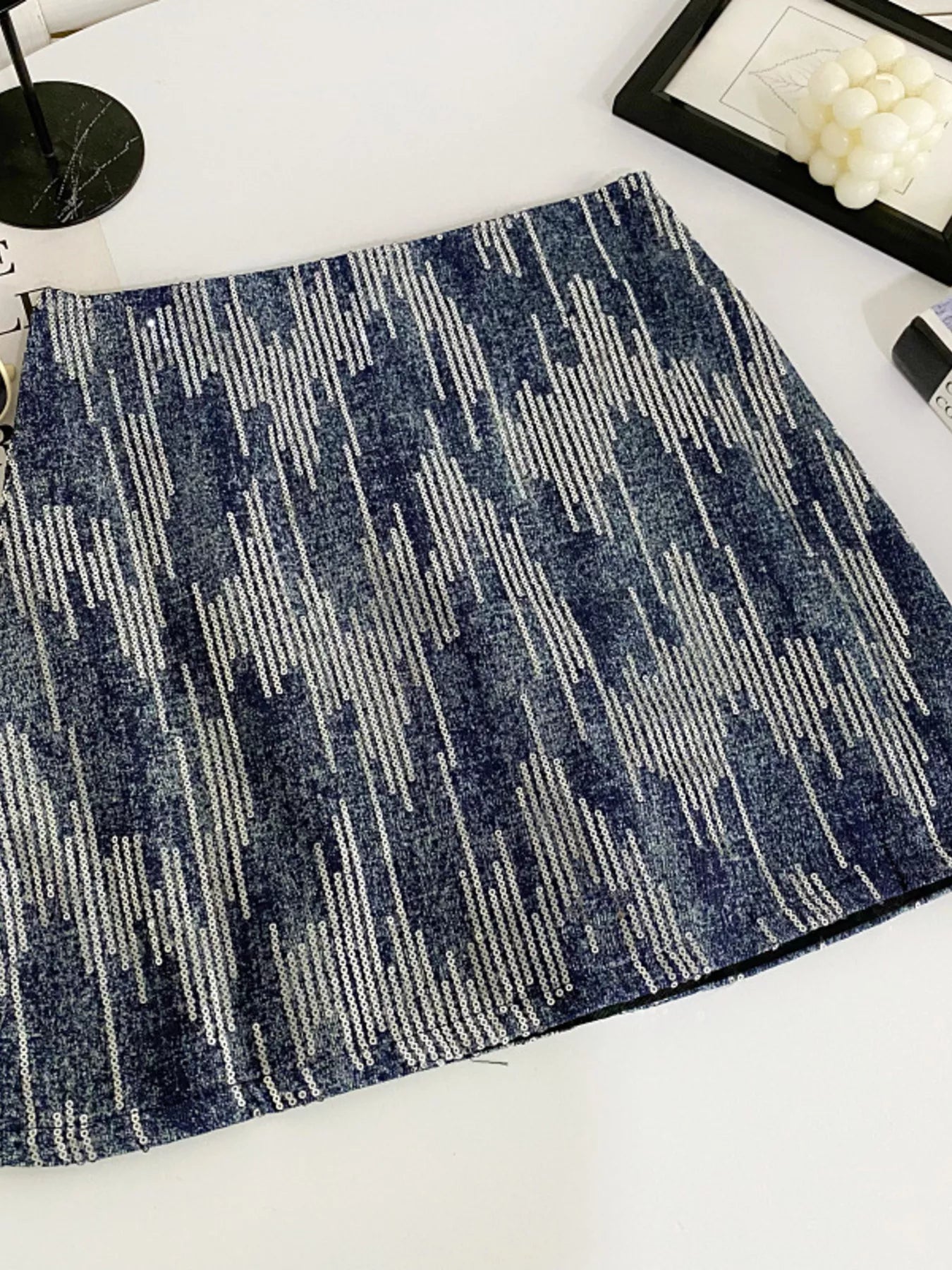 Blue patterned rug on a white surface