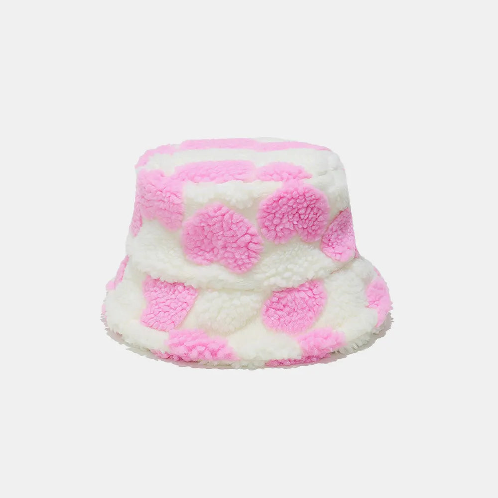 Pink and white checkered bucket hat on a light pink background