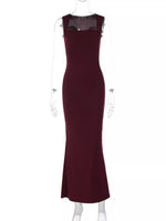 Maroon evening gown on a mannequin against a white background
