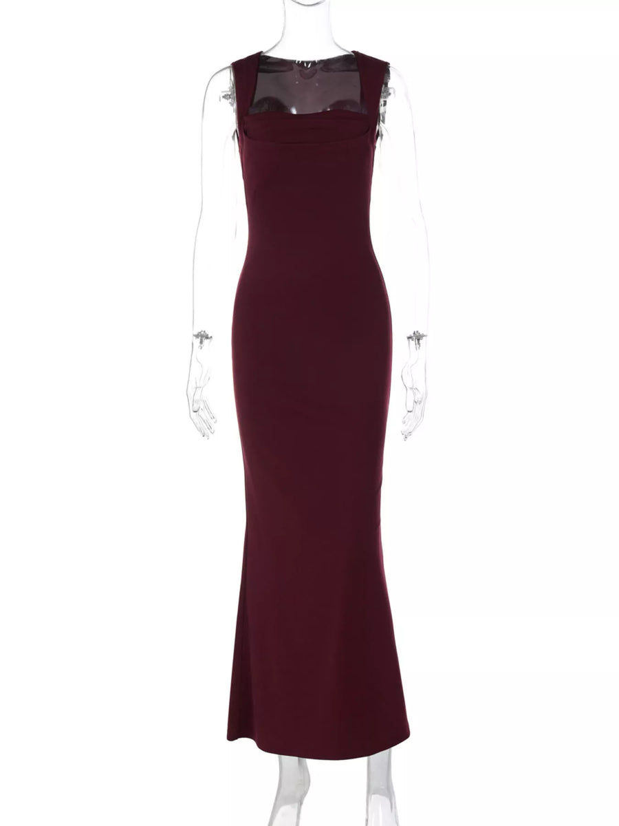 Maroon evening gown on a mannequin against a white background