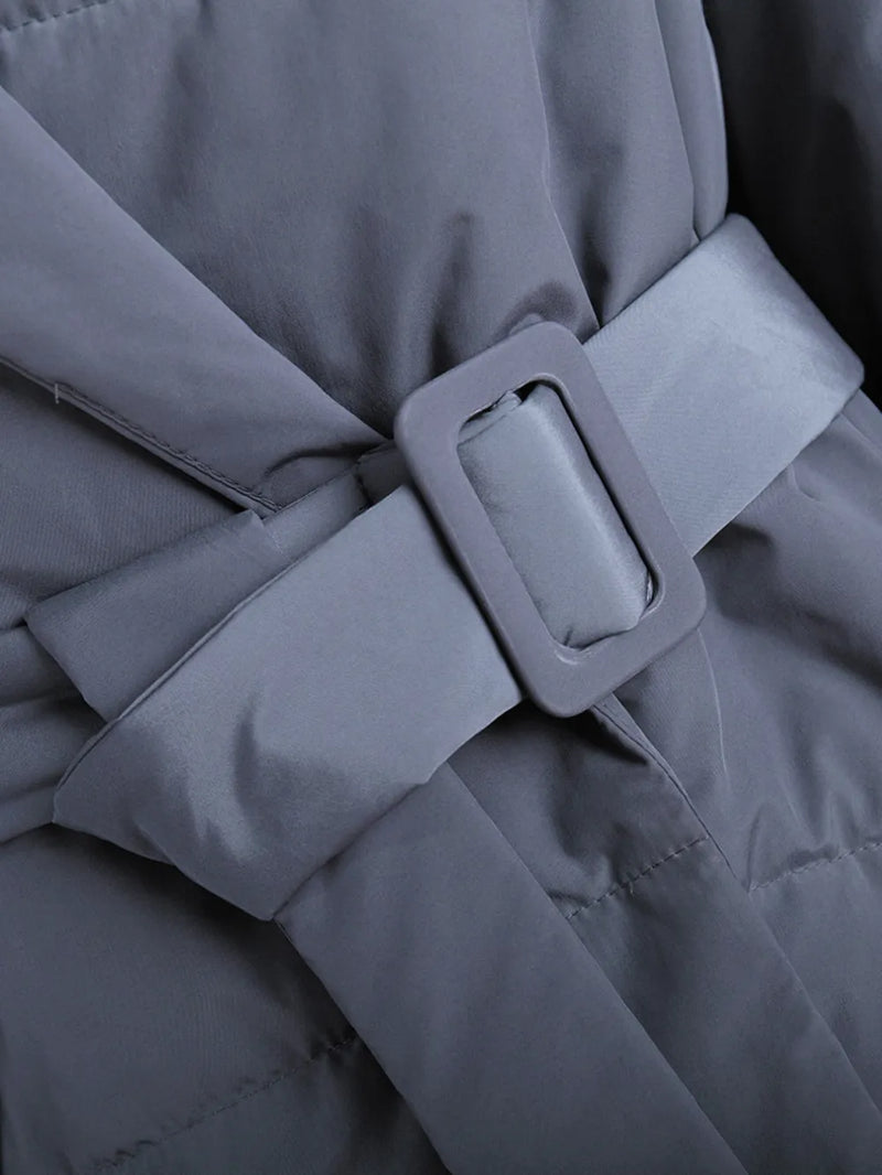 Gray coat with a belt and buckle close-up