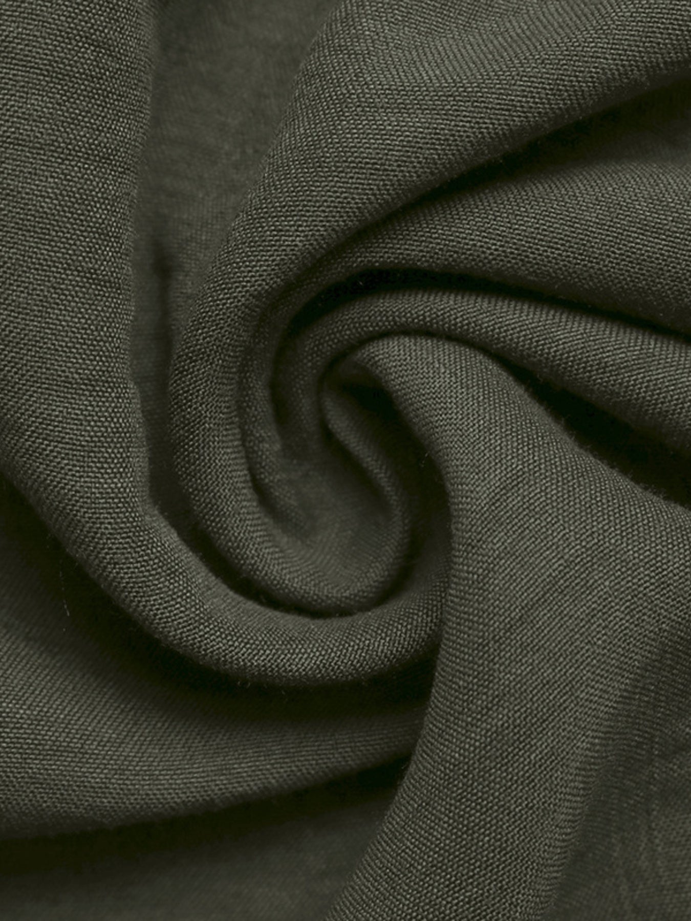 Close-up of dark green fabric with a subtle pattern