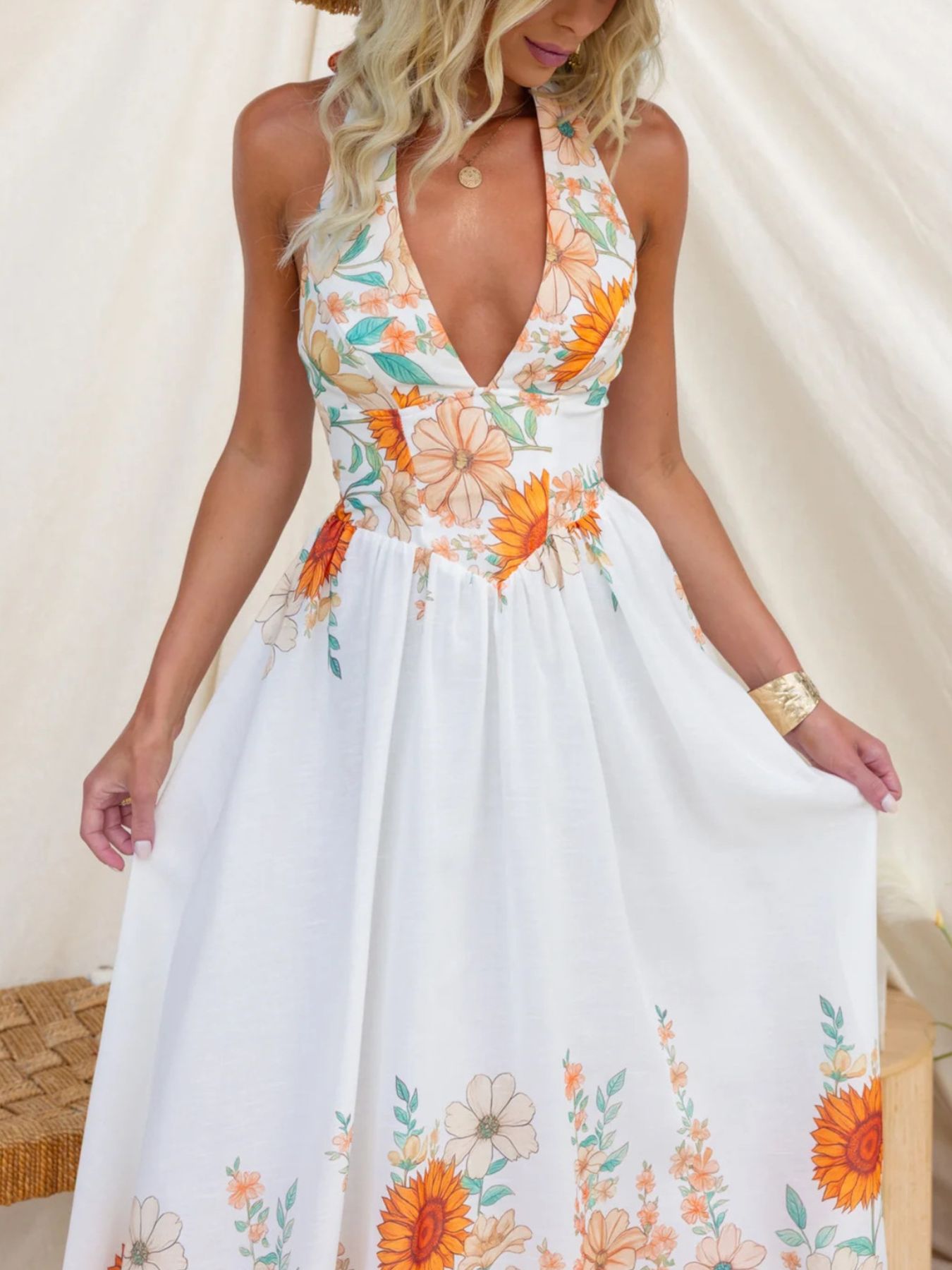 Woman wearing a floral dress with a white background