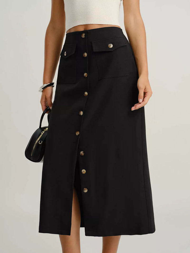 Black button-up skirt worn by a person on a plain background