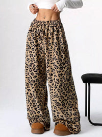 Leopard print wide-leg pants worn by a person on a white background