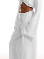 White pants with a drawstring waist on a white background