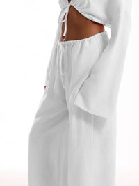 White pants with a drawstring waist on a white background